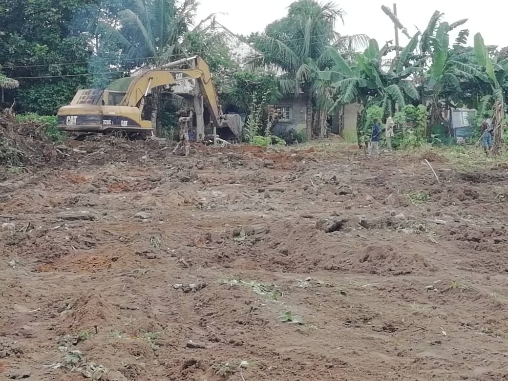 PIX 2(23): THE BULLDOZER DOING A REASONABLE WORK IN THE SITE