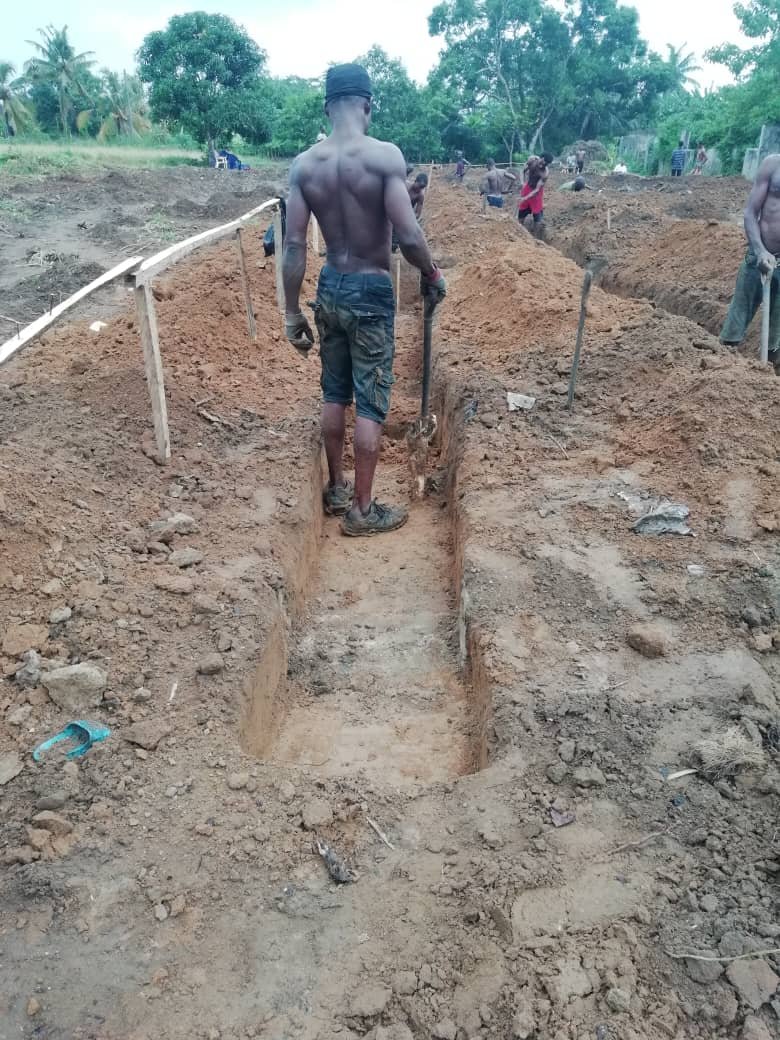 PIX 3(29): EXPERIENCED WORK MEN DIGGING FOUNDATION.
